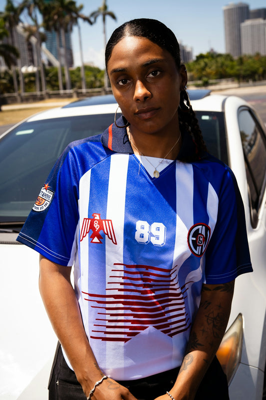 Woman in a blue and white striped jersey