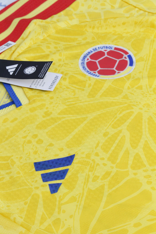 Yellow colombian football jersey with crest and adidas logo.
